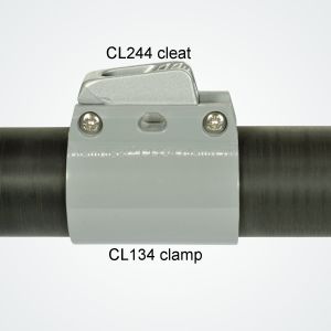 Photos of CL134 clamp holding a Clamcleat® CL244 cleat onto a boom tube.